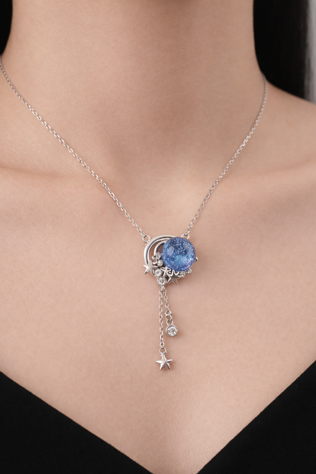 Celestial Blue Sandstone Moon & Star Necklace | Silver Galaxy Pendant – Alphalurent Silver Alphalurent necklace featuring a crescent moon hugging a sparkling blue sandstone sphere, with dangling silver chains and crystal star charms.