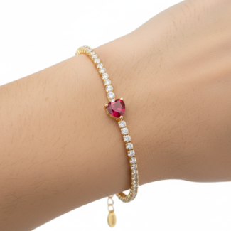 Alphalurent gold tennis bracelet featuring a single heart-shaped red zircon stone. (For the green image): Alphalurent gold vermeil tennis bracelet with a teardrop pear-shaped emerald green zircon.