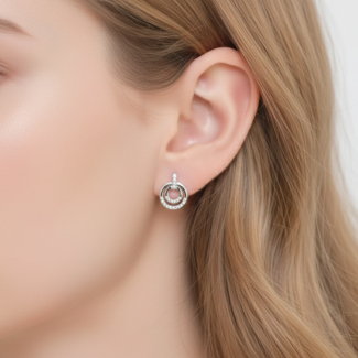 Alphalurent 925 sterling silver stud earrings featuring a geometric design with two interlocking circles, accented with sparkling pave crystals.