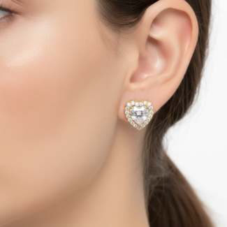 Alphalurent gold-plated 925 silver stud earrings featuring a large clear heart-shaped crystal surrounded by a halo of smaller pave stones.