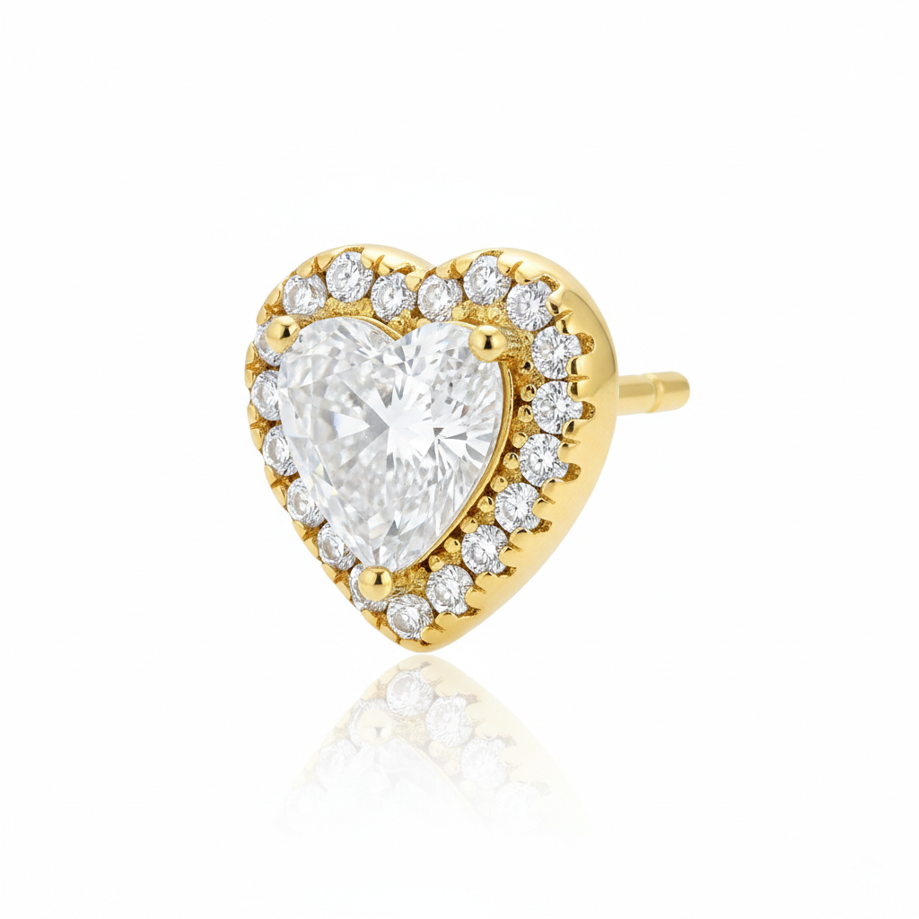 Alphalurent Stellar Heart Halo Stud Earrings | 14K Gold Plated 925 Sterling Silver Alphalurent gold-plated 925 silver stud earrings featuring a large clear heart-shaped crystal surrounded by a halo of smaller pave stones.