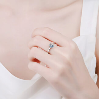 Alphalurent solid silver solitaire ring featuring a brilliant oval-cut center stone secured by a classic four-prong setting on a sleek, plain band.