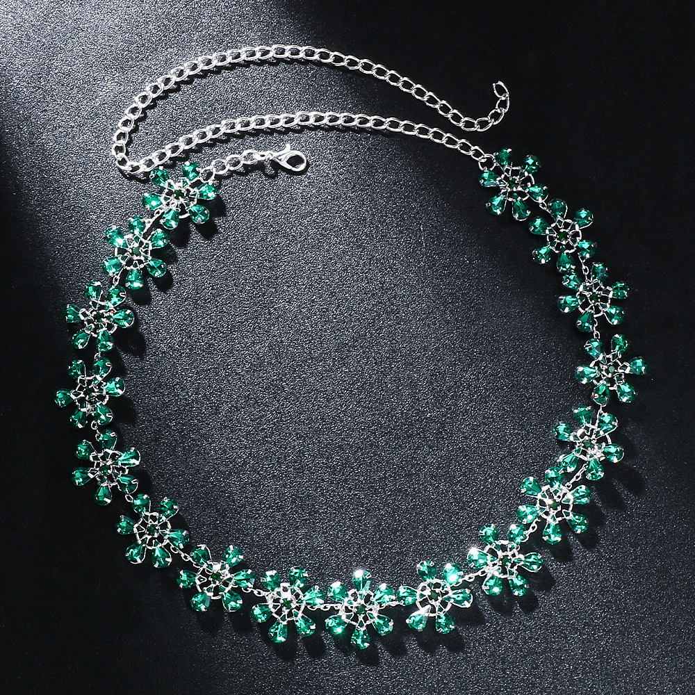 Alphalurent silver-plated floral necklace with emerald green rhinestone crystals.
