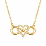 Infinity Lume gold plated necklace with infinity heart pendant and zircon center on velvet background