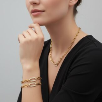 Alphalurent gold paperclip chain necklace featuring a central oval link completely encrusted with sparkling pave cubic zirconia stones.