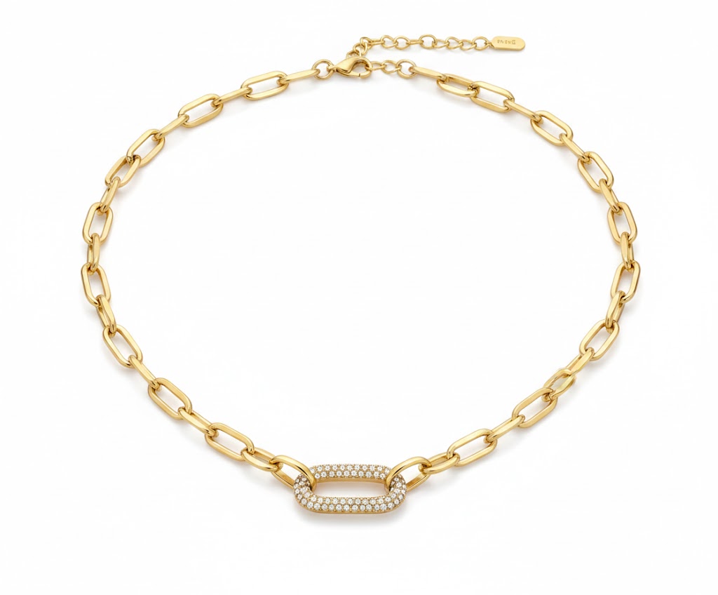 Alphalurent gold paperclip chain necklace featuring a central oval link completely encrusted with sparkling pave cubic zirconia stones.
