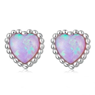 Alphalurent 925 sterling silver stud earrings featuring a heart-shaped iridescent blue opal crystal, a beaded silver edge, and comfortable screw-on ball backs.